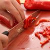 Professional cook school demonstrating knife skills during cooking course