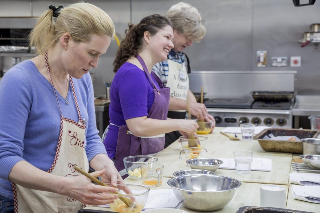 Edinburgh New Town Cookery School students learning culinary skills.