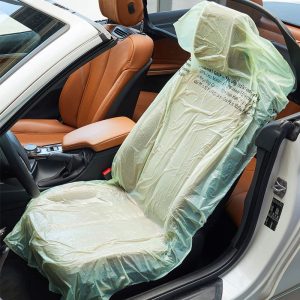 Alt Text: Smartgrip recycled non-slip car seat protector covers on roll for automotive workshop use